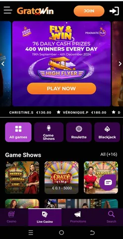 Fly & Win promotion su Gratowin Casino con 400 vincitori giornalieri, premi fino a 76.000€ e pulsante "Play Now" per tornei e game show in tempo reale